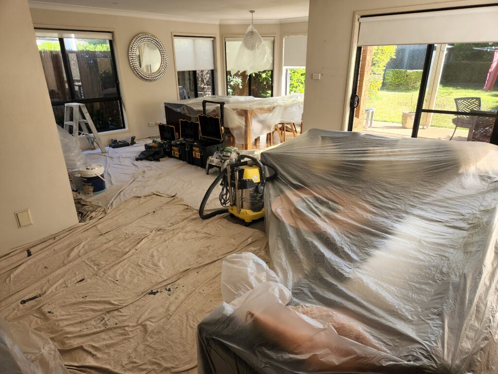Interior painting preparation in a Sutherland Shire home – furniture and floors fully covered