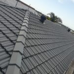 Repainted tiled roof with a modern protective coating in Sutherland Shire