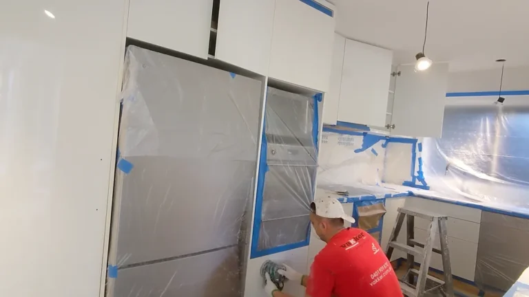 Vakker Australia painter sanding kitchen cabinetry during a house repaint in Mosman